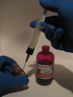 Refill as normal, using the syringe to push ink into the cartridge